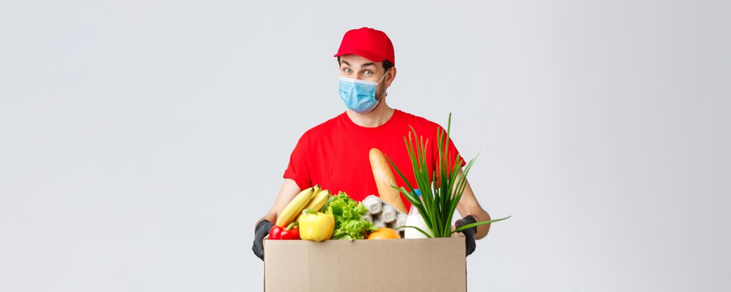 groceries-packages-delivery-covid19-quarantine-shopping-concept-friendly-courier-face-mask-gloves-red-uniform-bring-food-box-customer-ordered-online-contactless-deliver