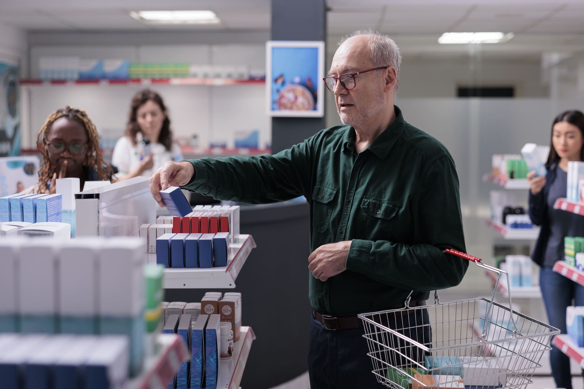 cheerful-old-customer-looking-pills-package-reading-prescription-during-drugs-shopping-pharmacy-elderly-man-client-choosing-buy-supplements-vitamin-health-care-products-min